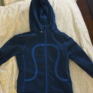Lululemon blue hooded zip up. Tight fitting, thumb holes on sleeve.